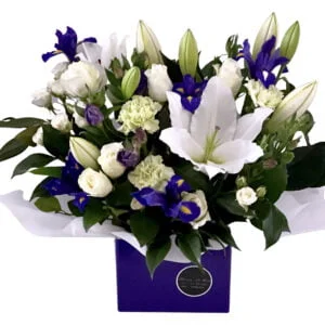 purple irises and white flowers arrangement