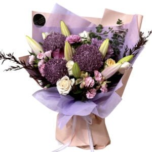 purple chrysanthemums and lilies and roses bouquet