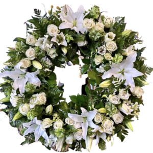 white lilies and roses funeral wreath