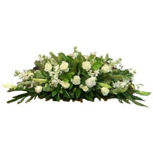 white roses and lilies casket flowers