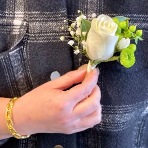 white rose button hole boutonniere
