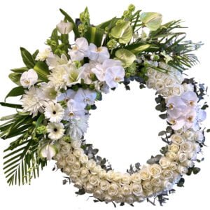 white rose and orchid funeral wreath round