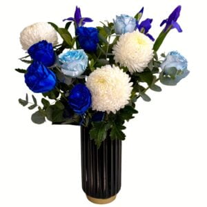 Blue Purple and White Flowers in a Black Tall Vase